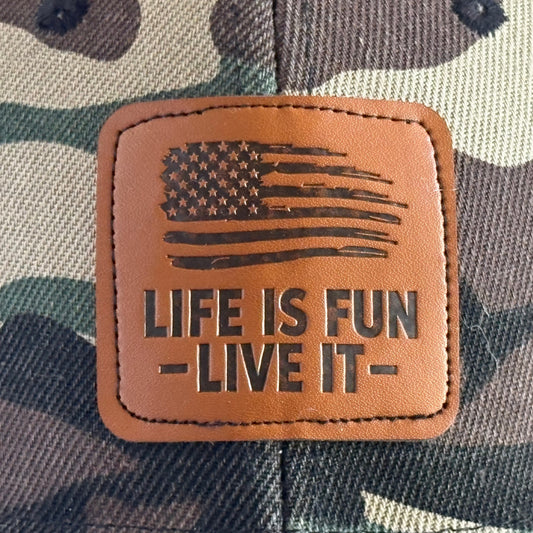 Woodland camo hat leather patch close-up - distressed American flag Life Is Fun Live It