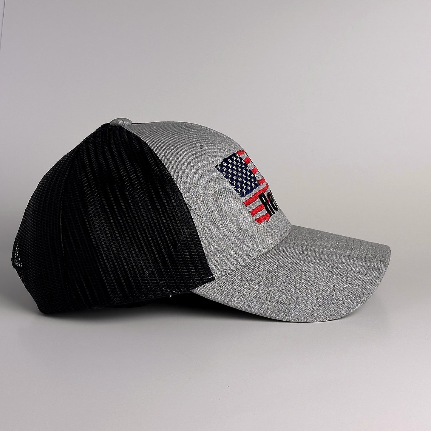 Grey and black mesh trucker hat with snapback side view