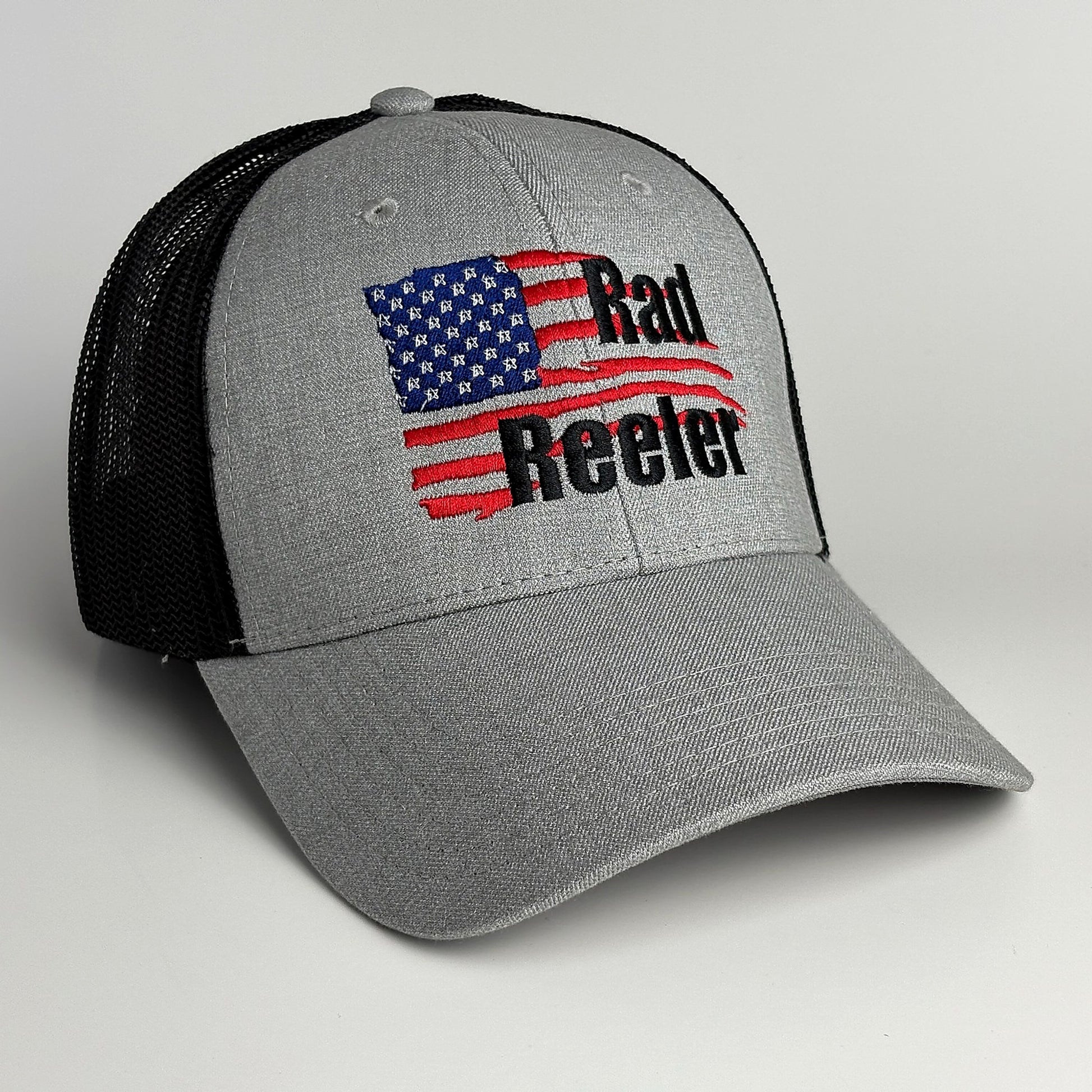 Grey and black mesh trucker hat with American flag Rad Reeler embroidery front view